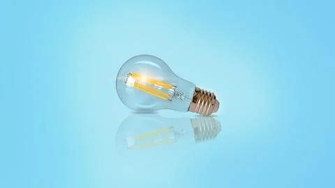 Creative light bulb abstract on glowing blue background new idea brainstorm.. Foto stock