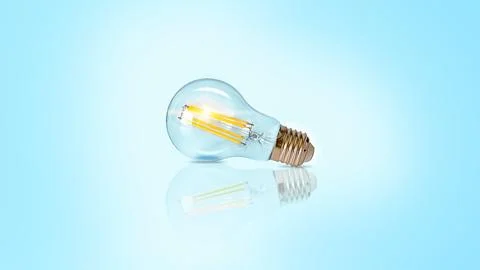 Creative light bulb abstract on glowing blue background new idea brainstorm.. Foto stock