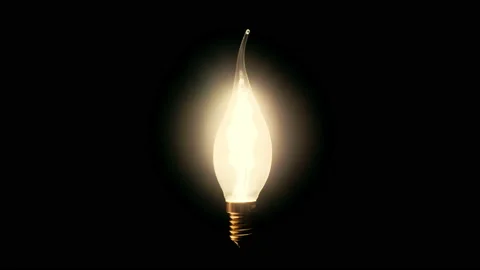 Creative light bulb Edison. The fire is lit in the wind Stock Footage 99827442
