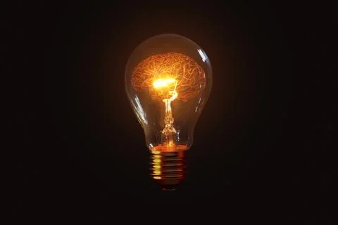 Creative light bulb glows with a brain on a black background, a creative id.. 库存照片