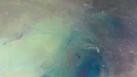 Creative Liquid Flows in Motion flows a bright brown and green color Mixing Stock Footage 146267447