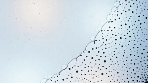 Creative Macro Shot of Ink Mixing with Bubbles and Dots in Motion Stock Footage 328356471