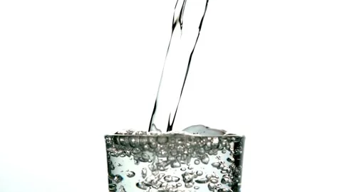 Creative macro slow motion video of white wine pouring into a glass. Soda ble Stock Footage 265842059