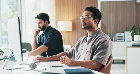 Creative, man and employee with computer, office and journalist with article on Stock Footage 329459692