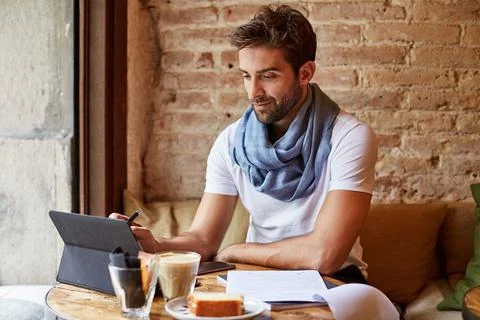 Creative, man and reading tablet in cafe for API specs, monitor server perf.. 写真素材
