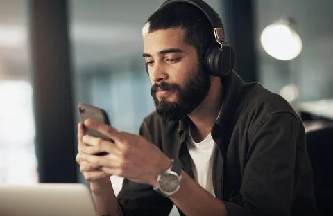 Creative, man and typing with smartphone, notes and video editor with night and Foto stock