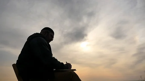 Creative man with ballpan outdoors approaching camera silhouette Stock Footage 88342876