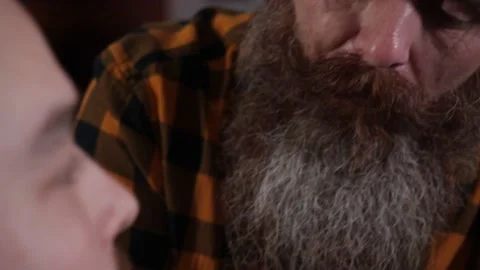 Creative man Barber cuts his beard to a young guy Video stock 146720089