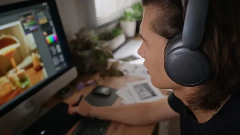 Creative Man Editing Digital Photo on Computer with Graphics Tablet Stock Footage 341945346