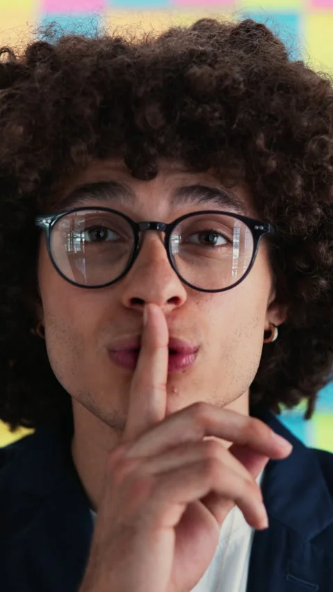 Creative man, face and shush with sticky note for startup secret or career 動画素材 322134714