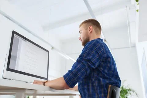 Creative man or programmer with computer at office Stock-Fotos