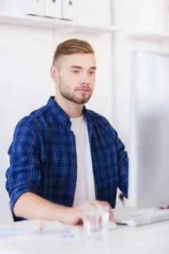 Creative man or student with computer at office Foto stock
