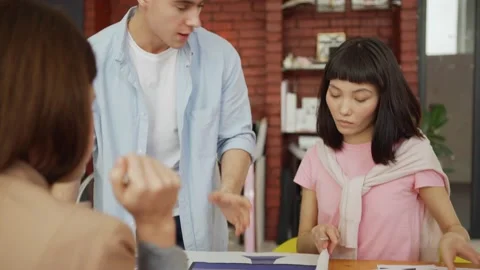 Creative man presenting ideas to colleagues 動画素材 134784528