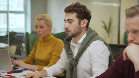 Creative man sharing ideas with colleagues Stock Footage 132815326