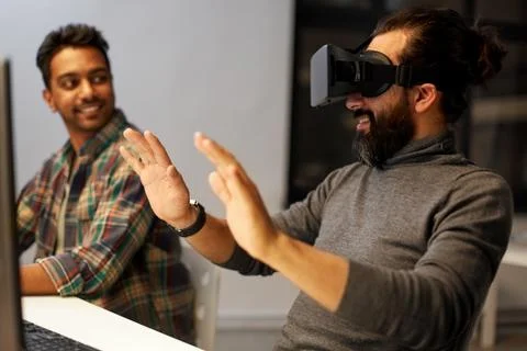 Creative man in virtual reality headset at office Stock Photos