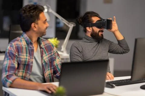 Creative man in virtual reality headset at office Stock Photos