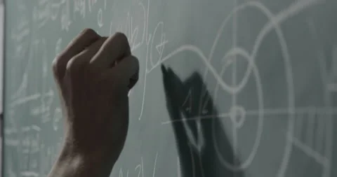 Creative mathematician writing formulas on the chalkboard Stock Footage 139264607