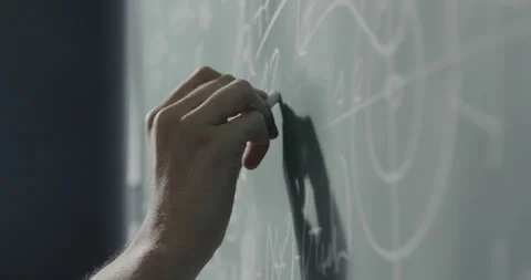 Creative mathematician writing formulas on the chalkboard Stock Footage 139265115