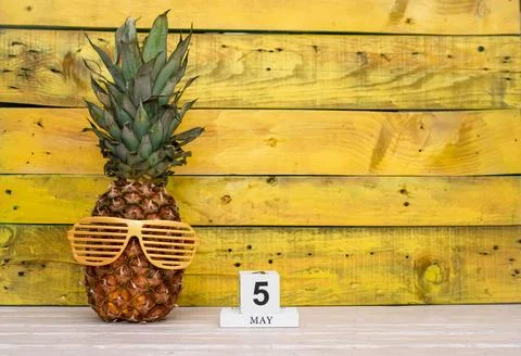 Creative May calendar planner with number  5. Pineapple character on bright.. Stock Photos