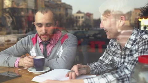 The creative meeting of two men in a cafe Stock-Footage 72649455