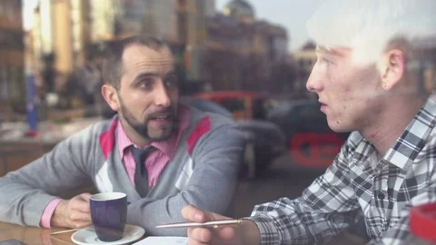 The creative meeting of two young men in a cafe Stock-Footage 72649507