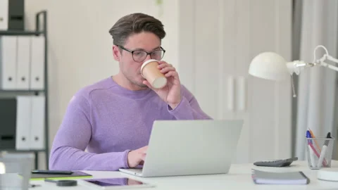 Creative Middle Aged Man Drinking Coffee at Work 스톡 동영상 143568301