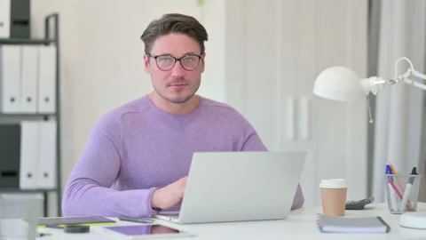 Creative Middle Aged Man with Laptop Shaking Head, Yes Stock Footage 143562169