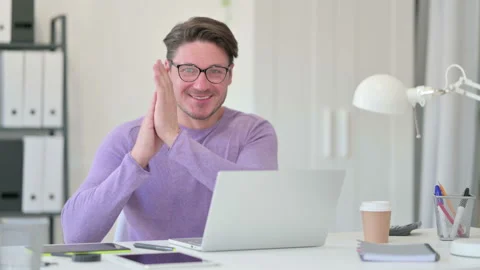 Creative Middle Aged Man with Laptop Clapping, Video stock 143562443