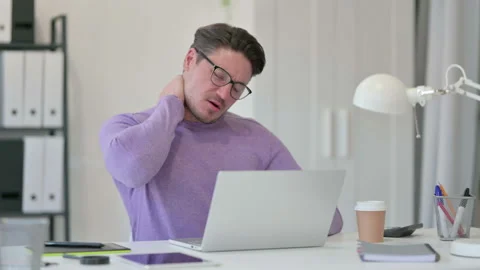 Creative Middle Aged Man with Laptop having Neck Pain in Office Video stock 143564793