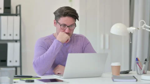 Creative Middle Aged Man with Laptop taking Nap in Office Stock Footage 143568641