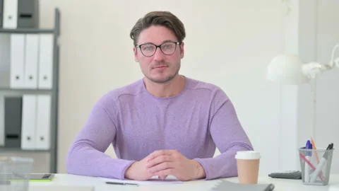 Creative Middle Aged Man Looing at the Camera Stock Footage 143563375