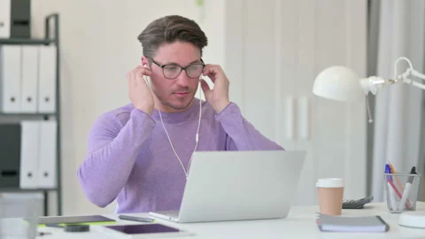 Creative Middle Aged Man Meditating Listening Music on Laptop Stock Footage 143567865