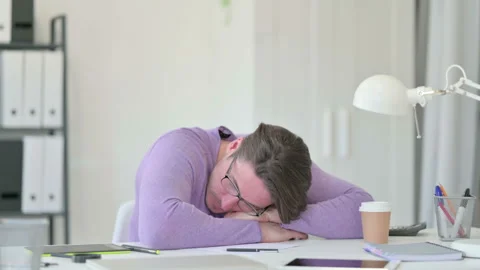 Creative Middle Aged Man Taking Nap on Table Video stock 143561830