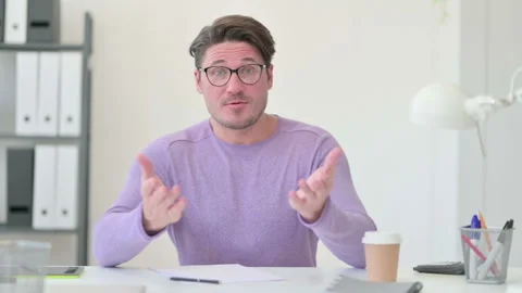 Creative Middle Aged Man Talking on Video Call Stock Footage 143567511