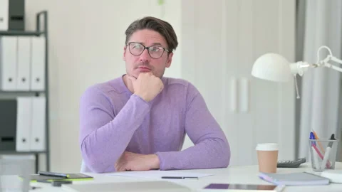 Creative Middle Aged Man Thinking in Office Stock Footage 143564014