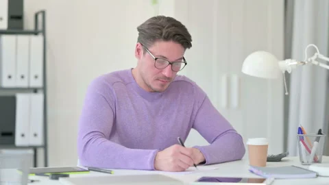 Creative Middle Aged Man Writing on Paper 스톡 동영상 143564204