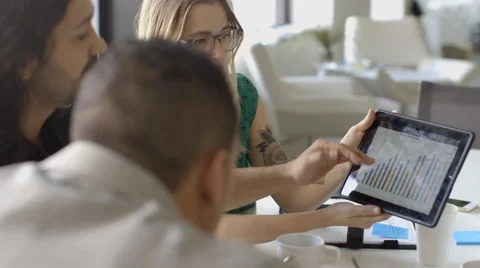 Creative millennial business people using digital tablet in meeting Stock Footage 66985199