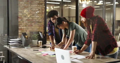 Creative millennial developers brainstorming in loft office. Diverse business Stock Footage 158453734