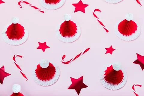 Creative minimal christmas pattern background. Christmas candy canes, red stars Stock Photos