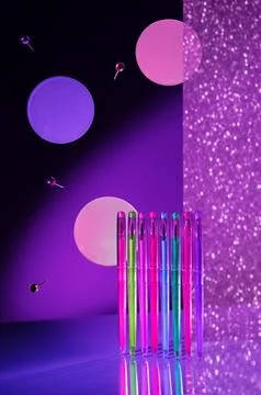 Creative minimal composition made with school supplies flying in the air in neon Stock Photos