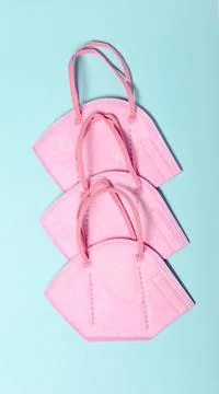 Creative minimal flat lay layer with KN95 or N95 FFP2 mask for protection pm 2.5 Stock Photos