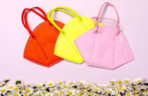 Creative minimal flat lay layer with KN95 mask for protection Stock Photos