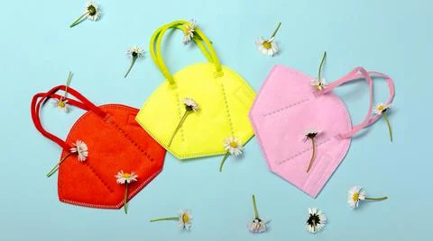 Creative minimal flat lay layer with KN95 mask for protection Stock Photos