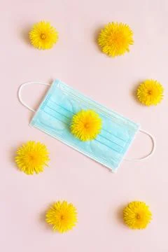 Creative, minimal, spring layout with flower. COVID-19 concept, protective ma Stock Photos