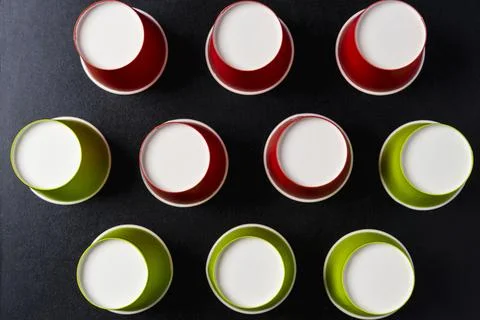 Creative minimalistic composition, pattern of inverted paper cups on a black  Stock Photos