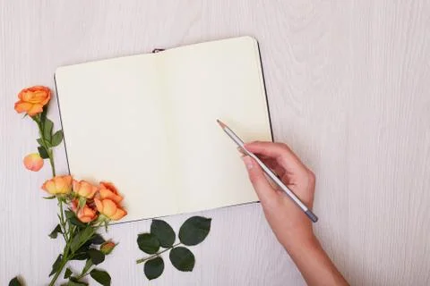 Creative mock up layout made with copy space on table. Open sketchbook. Hand Stock Photos