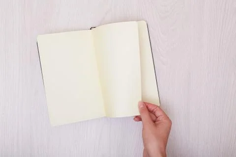 Creative mock up layout made with copy space on table. Open sketchbook. Hand Stock Photos