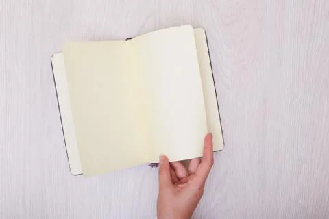 Creative mock up layout made with copy space on table. Open sketchbook. Hand Stock Photos