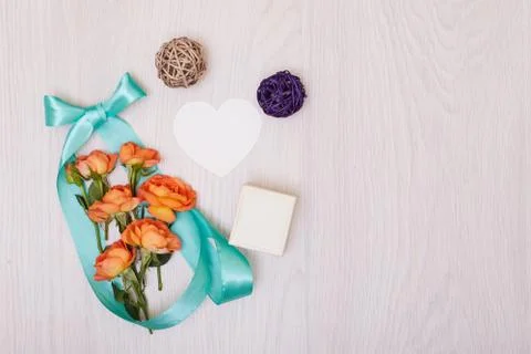 Creative mock up made of roses  with copy space on table. Empty sheet of card Stock Photos