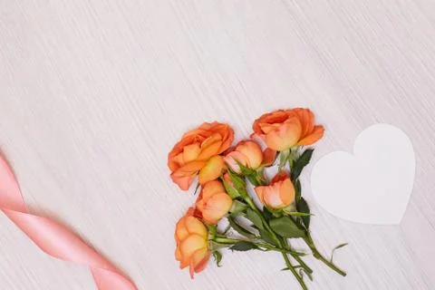Creative mock up made of roses  with copy space on table. Empty sheet of card Stock Photos